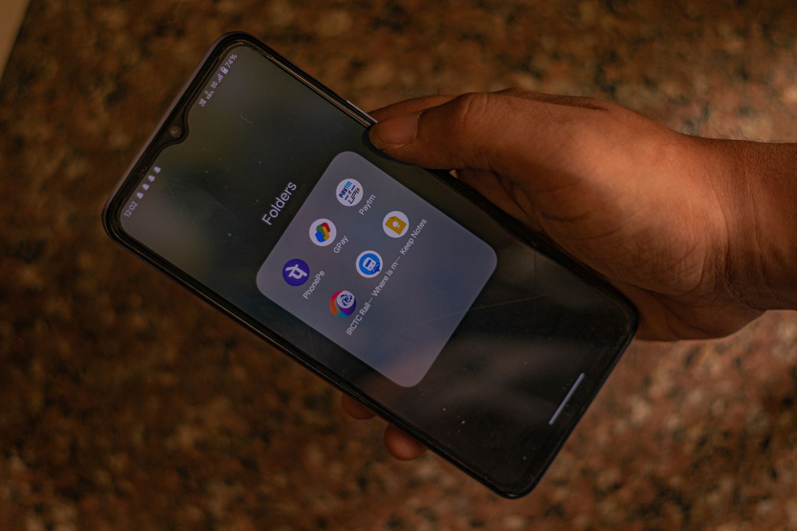 A person using payment applications on a smartphone in New Delhi
