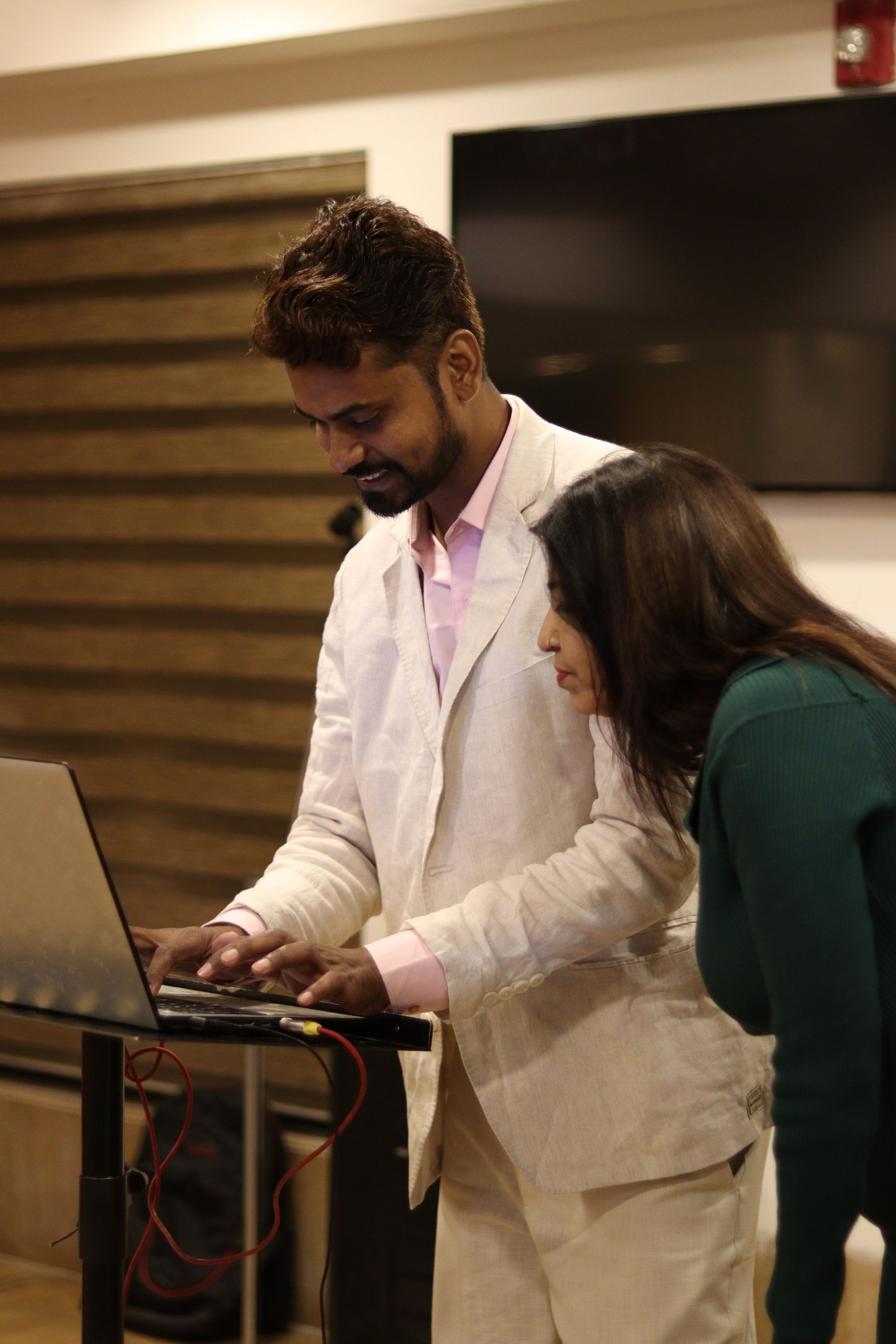 People collaborating around a table in a modern workspace